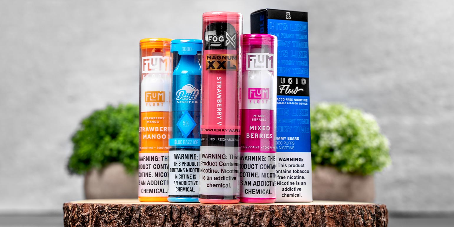 Vape Street Disposable Vape Devices: Flum Float Strawberry Mango, Flum Float Mixed Berries, Puff Xtra Limited Blue Razz Ice, Fog X Magnum XXL, and Lucid Flow Gummy Bears